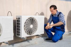 technician working on heat pump